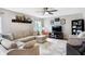 Inviting living room with comfortable seating, a ceiling fan, and neutral decor for a relaxing atmosphere at 12635 Braddock Ln, Noblesville, IN 46060
