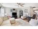 Comfortable living room with stylish furnishings, a ceiling fan, and hardwood floors perfect for relaxing at 12635 Braddock Ln, Noblesville, IN 46060