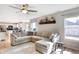 Spacious living area with hardwood floors, ample natural light, and a large sectional sofa perfect for gatherings at 12635 Braddock Ln, Noblesville, IN 46060