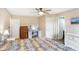 Bright main bedroom featuring a ceiling fan, desk/vanity and neutral paint at 12635 Braddock Ln, Noblesville, IN 46060