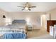 Inviting main bedroom with ceiling fan, neutral colors, and convenient ensuite bathroom at 12635 Braddock Ln, Noblesville, IN 46060