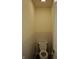 Simple half bath features wainscoting and offers essential convenience for guests and residents alike at 13509 Dunes Dr, Carmel, IN 46032