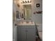 Clean bathroom with gray vanity, modern sink, and neutral decor at 13509 Dunes Dr, Carmel, IN 46032