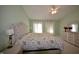 Bright bedroom offering a cozy atmosphere with a large window and a decorative chandelier at 13509 Dunes Dr, Carmel, IN 46032