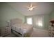 Comfortable bedroom featuring a ceiling fan and light gray carpet for a warm and inviting space at 13509 Dunes Dr, Carmel, IN 46032