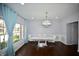 Dining room with modern table, chairs, and chandelier at 13509 Dunes Dr, Carmel, IN 46032