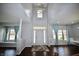 Entryway with hardwood floors, chandelier, and natural light at 13509 Dunes Dr, Carmel, IN 46032