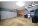 Large garage features a water heater, storage racks, and plenty of space for parking at 13509 Dunes Dr, Carmel, IN 46032