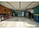 Spacious two-car garage with ample storage space and a refrigerator at 13509 Dunes Dr, Carmel, IN 46032
