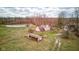 Aerial view of the houses, barns, sheds, and a pond at 15123 E 196Th St, Noblesville, IN 46060