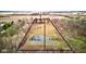 Aerial view of property divided into 1.5, 3.5, and 5 acre sections, featuring a pond and wooded areas at 15123 E 196Th St, Noblesville, IN 46060