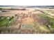Overhead view of the property showcasing a pond and surrounding greenery at 15123 E 196Th St, Noblesville, IN 46060
