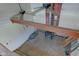 View of exposed beam ceiling with fan from unfinished attic with plywood floors offering customization potential at 15123 E 196Th St, Noblesville, IN 46060