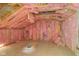 Unfinished attic with exposed pink insulation in walls and ceiling and plywood floors is ready to be finished at 15123 E 196Th St, Noblesville, IN 46060