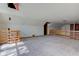 Unfinished attic space with exposed rafters and plywood flooring is ready for customization and completion at 15123 E 196Th St, Noblesville, IN 46060