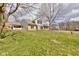 View of the two-story home with attached covered patio and a spacious lawn at 15123 E 196Th St, Noblesville, IN 46060