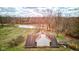 Aerial view of the rear of a home showing the yard and sunroom at 15123 E 196Th St, Noblesville, IN 46060
