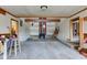 Spacious living room with exposed beams, unfinished floors, and fireplace at 15123 E 196Th St, Noblesville, IN 46060