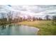Aerial view of pond highlighting the expansive green space and surrounding trees at 15123 E 196Th St, Noblesville, IN 46060