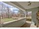 View of the yard from covered porch and wooden floors at 15123 E 196Th St, Noblesville, IN 46060