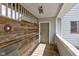 Exterior porch view with wood plank flooring and damaged lighting at 15123 E 196Th St, Noblesville, IN 46060