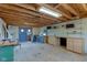 Spacious workshop interior featuring unfinished wood ceiling, cabinets, and open floor plan at 15123 E 196Th St, Noblesville, IN 46060