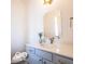 Charming half bathroom with stylish vanity, modern mirror, and elegant fixtures at 15304 Fairlands Dr, Westfield, IN 46074