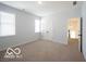 Bright bedroom with carpet, windows, and a double door closet at 15304 Fairlands Dr, Westfield, IN 46074