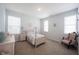 Comfortable bedroom with pink accents, a four-poster bed, and a plush chair, creating a relaxing retreat at 15304 Fairlands Dr, Westfield, IN 46074