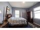 Spacious bedroom with four poster bed, wood flooring and dual windows providing natural light at 15304 Fairlands Dr, Westfield, IN 46074