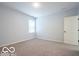 This clean bedroom features neutral carpet and fresh paint at 15304 Fairlands Dr, Westfield, IN 46074