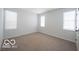 This bedroom has three windows, neutral carpet, and is freshly painted at 15304 Fairlands Dr, Westfield, IN 46074