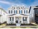 Charming two-story home featuring a welcoming front porch and a beautifully landscaped yard at 15304 Fairlands Dr, Westfield, IN 46074