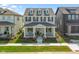 Beautifully landscaped front yard leading to a charming two-story home with a welcoming front porch at 15304 Fairlands Dr, Westfield, IN 46074