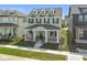 Beautifully landscaped front yard leading to a charming two-story home with a welcoming front porch at 15304 Fairlands Dr, Westfield, IN 46074