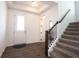 Elegant foyer features hardwood floors, a staircase, and ample natural light at 15304 Fairlands Dr, Westfield, IN 46074