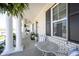 Inviting covered porch with white columns and view of the exterior at 15304 Fairlands Dr, Westfield, IN 46074