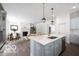 Modern kitchen featuring granite countertops, stainless steel appliances, and an open view of the dining area at 15304 Fairlands Dr, Westfield, IN 46074