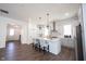 Bright kitchen featuring an island with pendant lighting, stainless steel appliances and ample countertop space at 15304 Fairlands Dr, Westfield, IN 46074