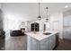 Open kitchen with island overlooking the living room, creating a seamless and inviting space at 15304 Fairlands Dr, Westfield, IN 46074