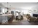 Spacious living room with an open layout connecting the kitchen, dining area, and a cozy living space at 15304 Fairlands Dr, Westfield, IN 46074