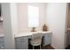 Bright mudroom with a built-in desk area, cabinets, and a comfortable chair at 15304 Fairlands Dr, Westfield, IN 46074