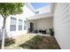 Back patio of home has outdoor furniture and is surrounded by fenced-in yard and exterior of house at 15304 Fairlands Dr, Westfield, IN 46074