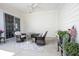Outdoor patio features comfortable seating with a table and ceiling fan for relaxation at 15304 Fairlands Dr, Westfield, IN 46074