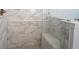 Shower features marble style tile and a built-in bench seat at 15304 Fairlands Dr, Westfield, IN 46074