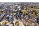 Wide aerial view of a neighborhood featuring well-maintained homes, mature trees, and cul-de-sac streets at 1621 Rosebud Ln, Greenwood, IN 46143