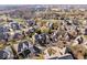 Stunning aerial view of a residential area showcasing houses with lush landscaping and mature trees at 1621 Rosebud Ln, Greenwood, IN 46143