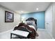 Cozy bedroom features a decorative headboard, accent wall and white bench at 1621 Rosebud Ln, Greenwood, IN 46143