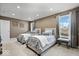 Bright bedroom featuring twin beds with stylish gray and white bedding, complemented by natural light from the windows at 1621 Rosebud Ln, Greenwood, IN 46143