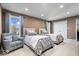 Bright bedroom with two beds, comfortable seating, and a view from the window at 1621 Rosebud Ln, Greenwood, IN 46143